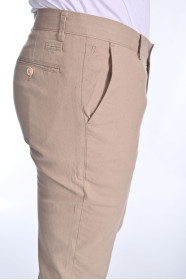 BEIGE COLORED, REGULAR-FIT CHINO TROUSERS.