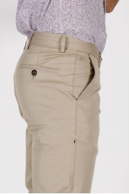 BEIGE COLORED, SLIM-FIT CHINO TROUSERS.